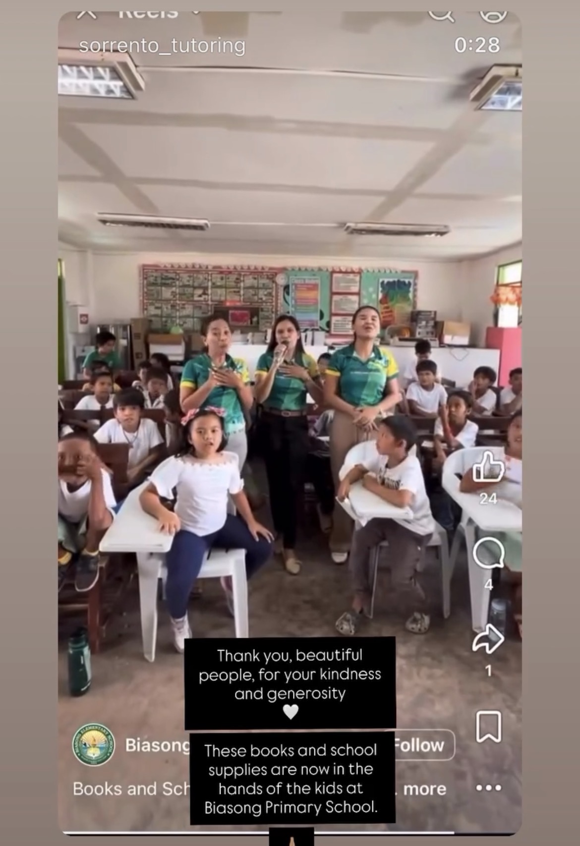 Teachers and students receiving donated books and school supplies